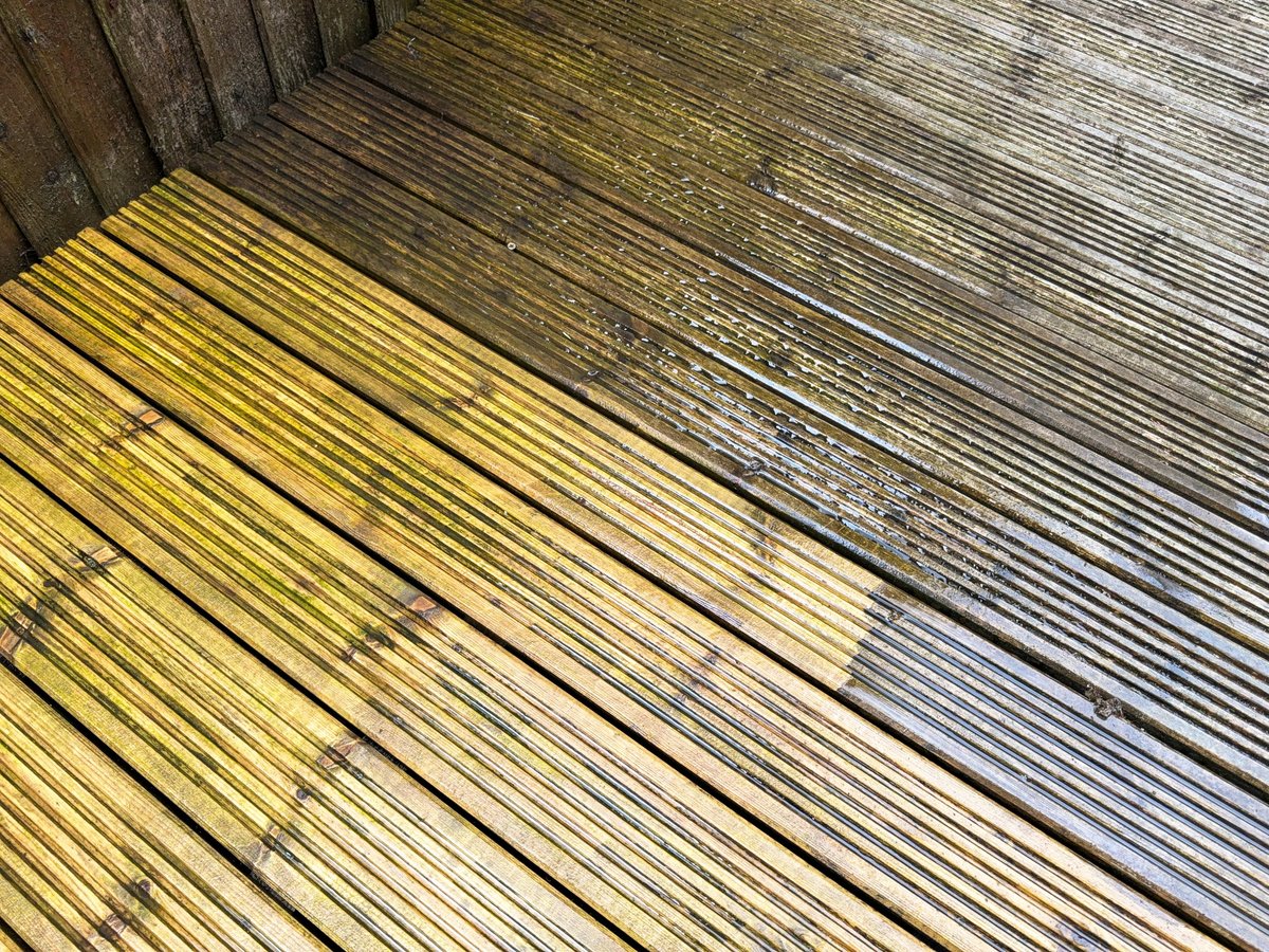Before and after view of dirt and grime being cleaned from wooden decking